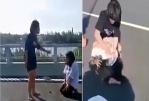 Nữ sinh lớp 7 bị đàn chị hành hung, lột áo giữa cầu